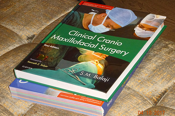 Clinical Cranio-Maxillary Surgery textbook, the first craniomaxillofacial surgery textbook by an Indian author and also the first by a single author