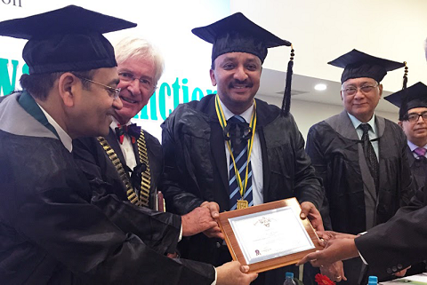 Dr. A. Kumar Swamy placing the Presidential Collar on President Dr. S.M. Balaji. Also seen are Dr. Phillip Dowell, UK, ICD International President & Dr. Rajiv Chugh, Secretary General, ICD