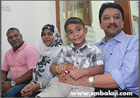 The child with Dr. S.M. Balaji before dental implant surgery