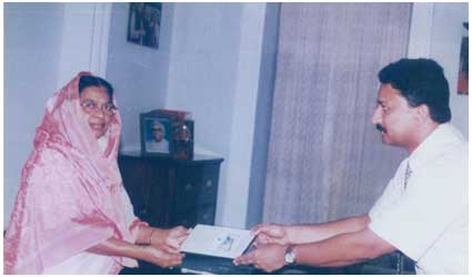 Receiving the Award of Excellence from Her Excellency Ms. Fathima Beevi, Governor of Tamil Nadu